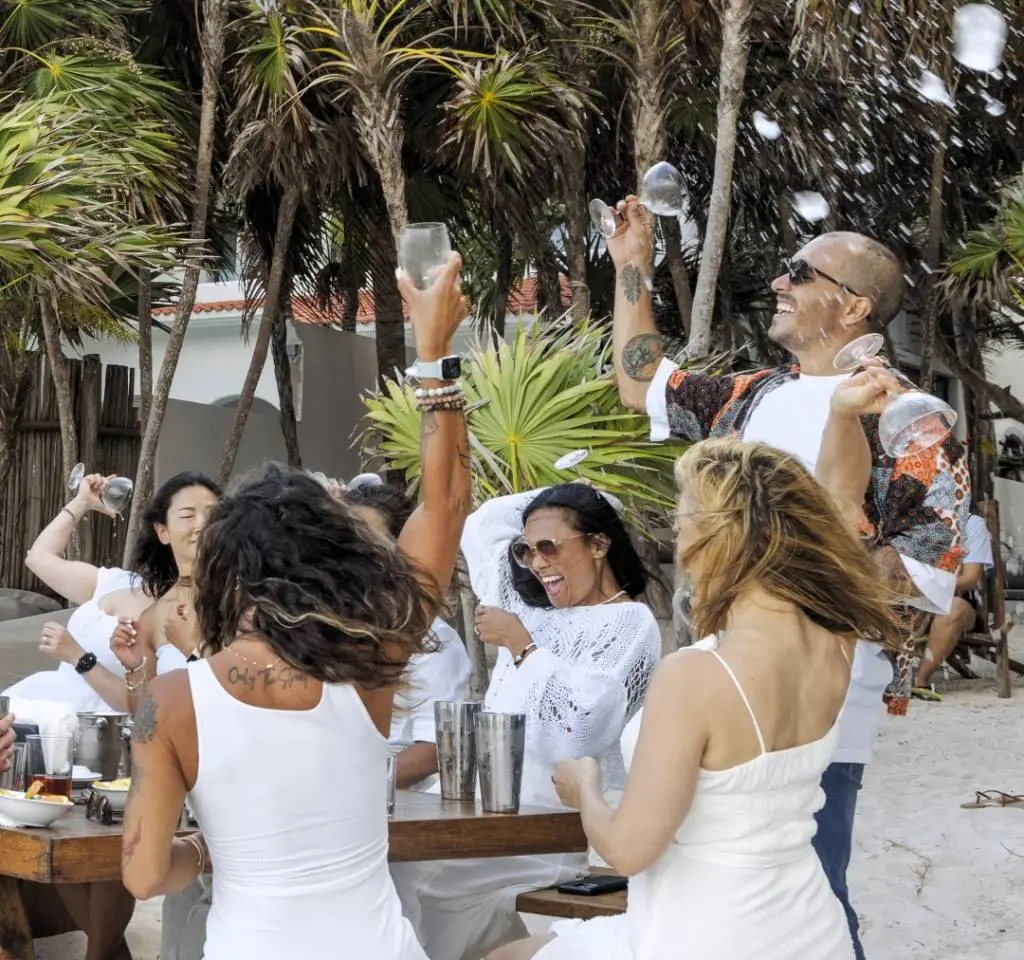 Group of friends enjoying a premium tequila tasting experience in Tulum.